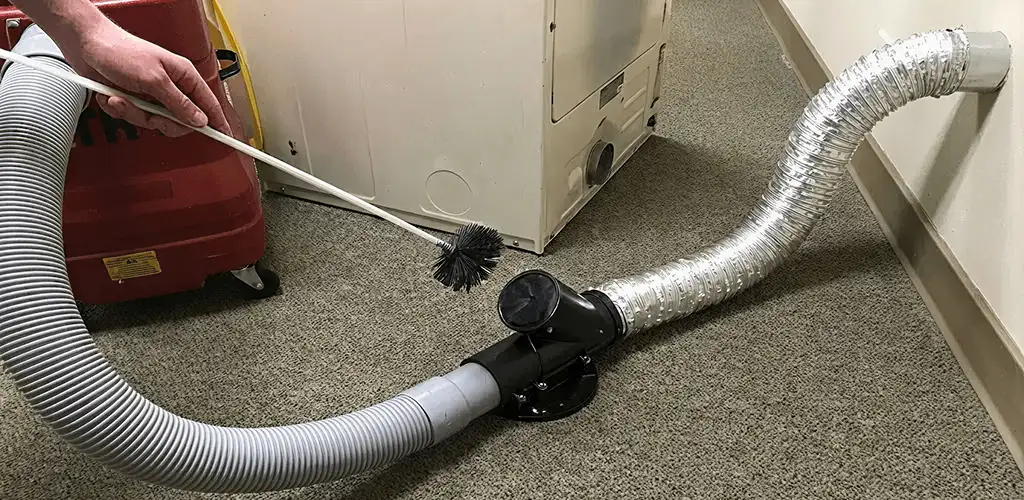 Dryer vent cleaning service removing lint from a dryer duct connection in Chattanooga, TN