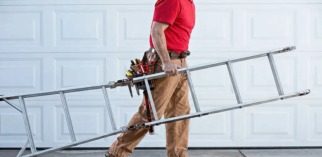 Garage door repair technician arriving with tools and ladder in Chattanooga, TN