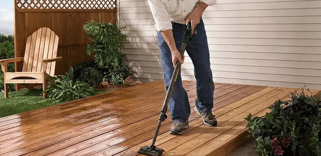 Deck staining service applying stain to a backyard wood deck in Chattanooga, TN
